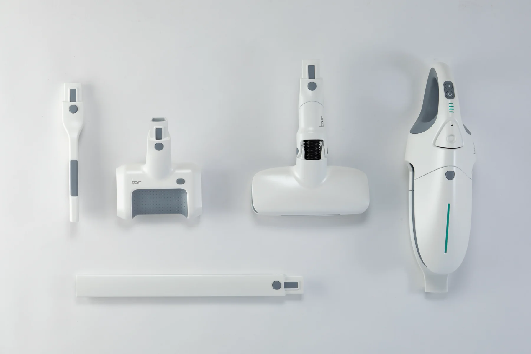 Vacuum cleaner and accessories arranged as a component flat lay
