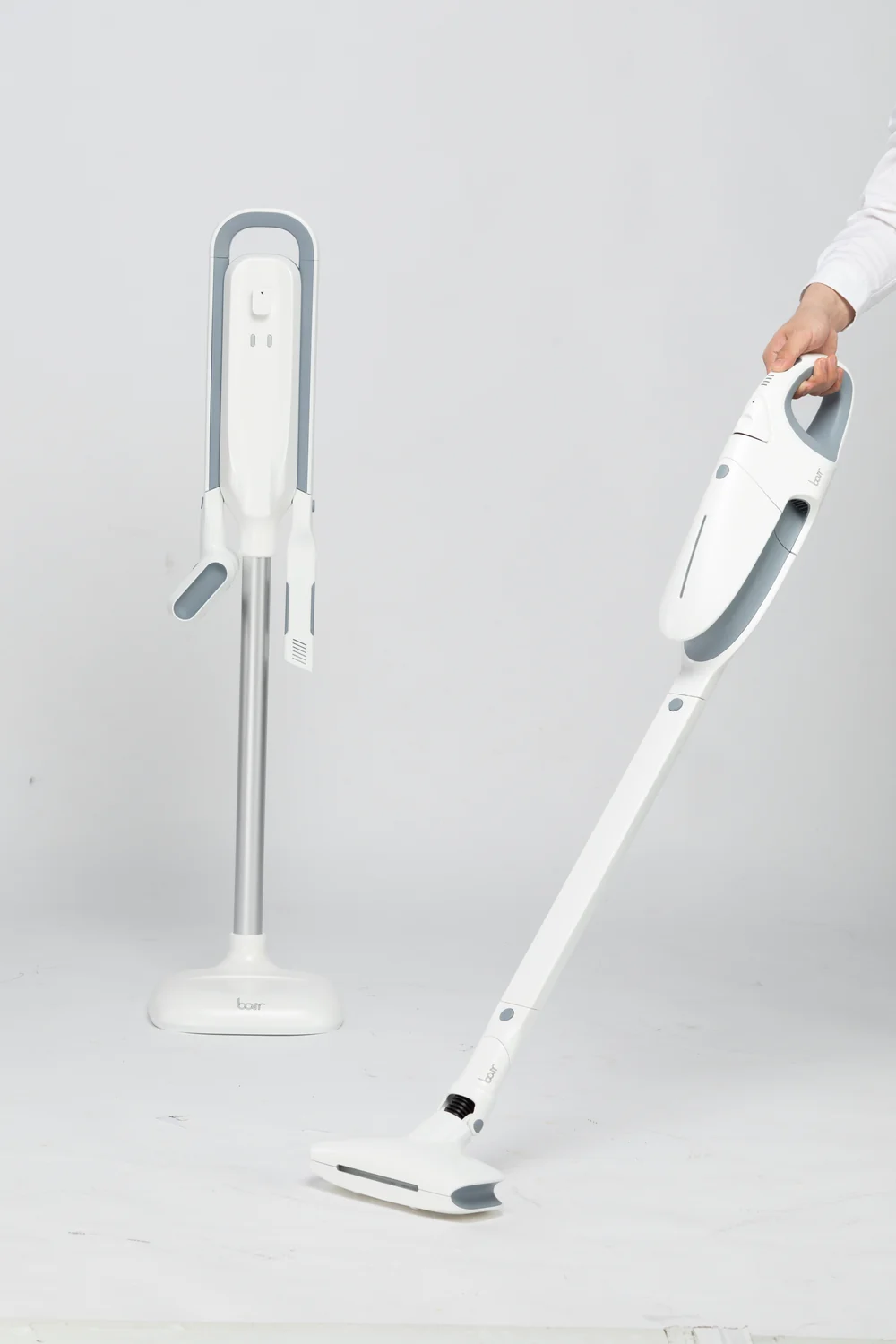 Vacuum cleaner shown in floor-cleaning use